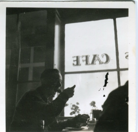 1949 Man eating inside new lodge