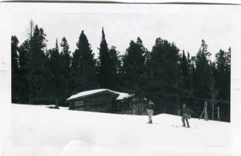 1950s Bovey Motor Shack with 2 men skiing