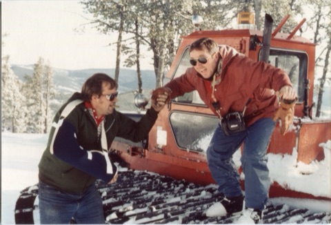 1970s Joe Pinski helping Dave Cleary off snowcat