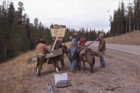 1974 Film Crew at Showdown people near highway at sign
