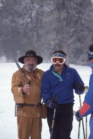 1980s AJ Buskirk holding old timey rifle and Scott Mosher with goggles on - George Willett Era
