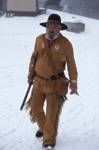1980s AJ Buskirk walking with Rifle