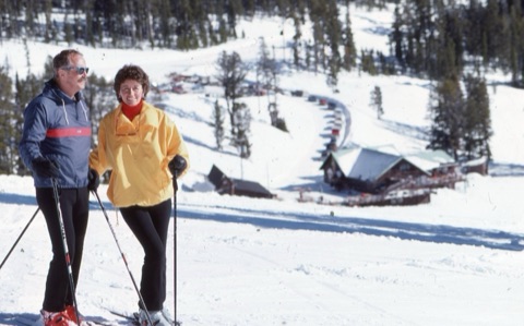 1980s George Willett and Margie Willett with lodge in background