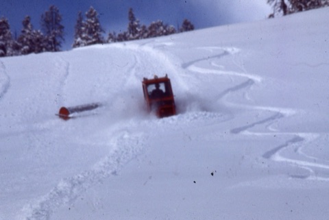 1980s Snow Groomer next to ski tracks