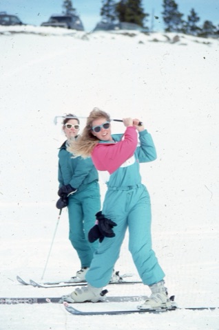1989 Pam Gold playing skolf with unknown person in back