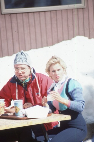 1989 unknown man and woman on lodge deck eating