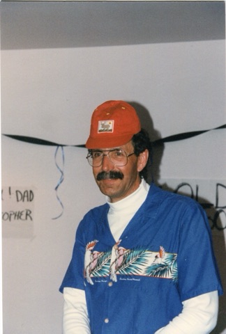 1990s Bill "Idaho" Trenberth with red hat at party