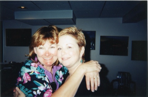 1990s Bonnie Noble and Katie Boedecker hugging in bar