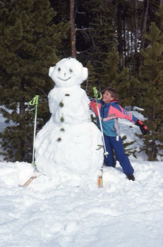 1990s Charley Willett building a snowman