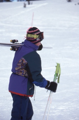 1990s Charley Willett carrying skiis