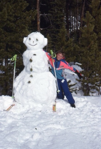 1990s Charley building snowman with bunny ears