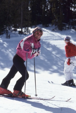 1990s Joan Rostad smiling and leaning