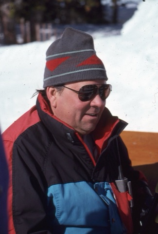 1990s Joe Pinski sitting on deck smiling