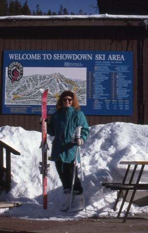 1990s Kristie Grochelle near trailmap on deck