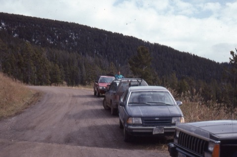 1990s Lyle Cigler and cars parked near lodge