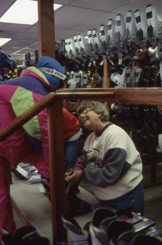1990s Rental Shop unknown woman fitting boots
