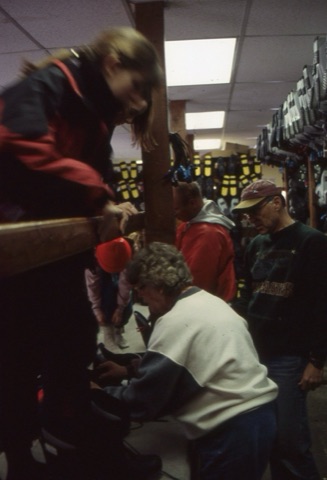 1990s Rental Shop, Leo Hurtz in red hat, unknown woman
