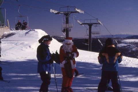 1990s Santa with unknown people on top of mountain