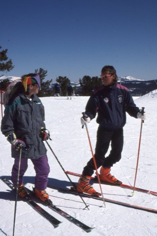 1990s Scott Dvorak with kid on top of mountain