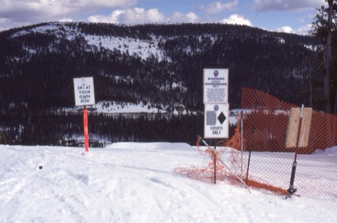 1990s Signs above black run