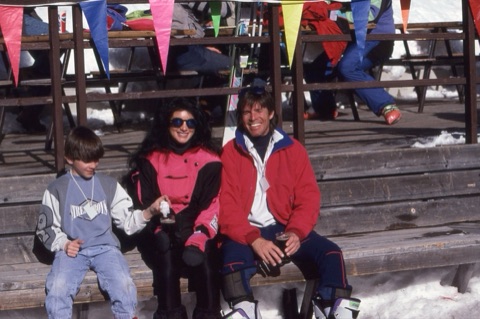 1990s kid, woman, man on deck smiling
