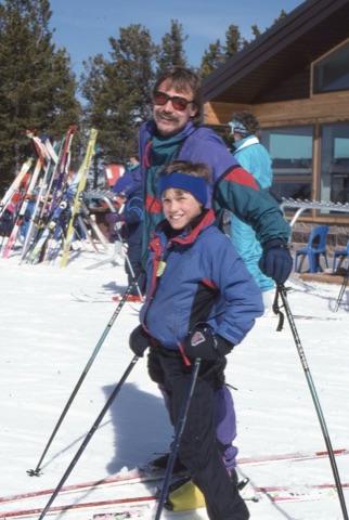 1990s man and kid on top of mountain