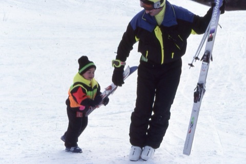 1990s unknown kid and man with skiis