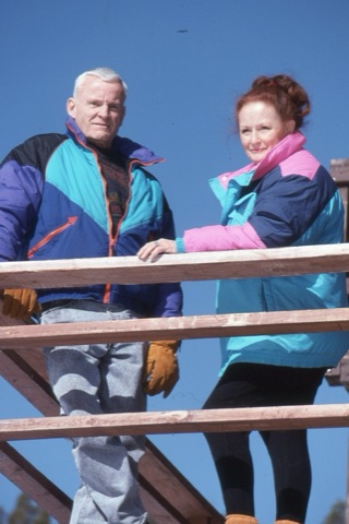 1990s unknown man and woman on lodge deck