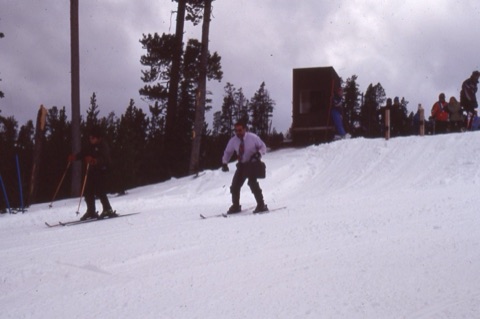 1990s unknown man skiing with brief case