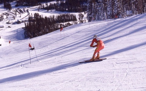 1990s unknown racer racing downhill with lodge at the bottom