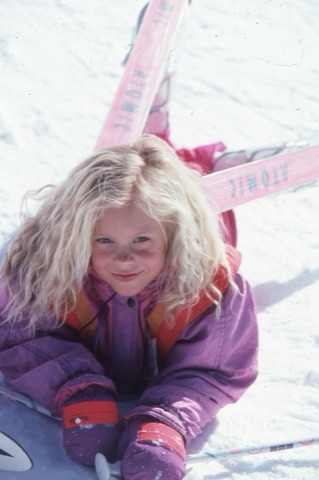 1990s unknown small girl laying in snow