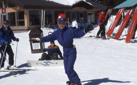 1990s unknown snowboarder with Chris Quinn in background