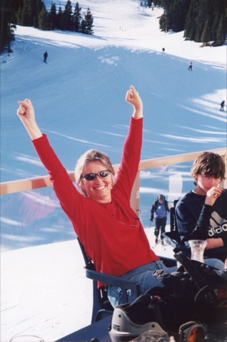2003 Margie Willett on the Hole in the Wall Saloon deck with the mountain behind