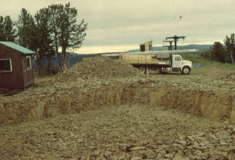 1994 Top Rock building beginning construction with lots of rocks, and truck