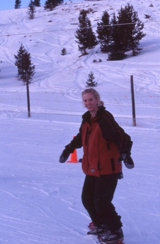 2000s Alice Katzenberger snowboarding in learning area and smiling