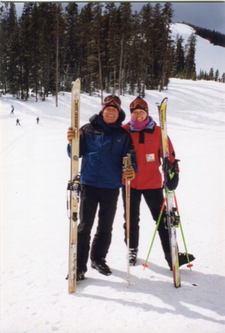 2000s Geroge Willett and Margie Willett with skiis with mountain behind