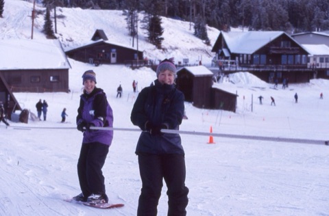 2000s Katie Boedecker (Willett) and Jamie Hurd (Willett) on rope tow with lodge in back