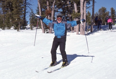 2000s unknown man skiing happy near top of mountain