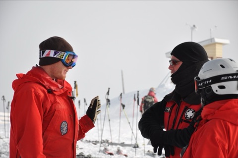2010 Eric Held head ski patroller on top of mountain with other ski patrollers