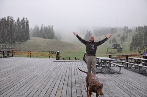 2010 George Willett with hands in air, tank the dog in front