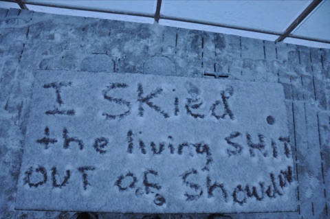 2010 I skied the living shit out of Showdown written on bar deck in the snow