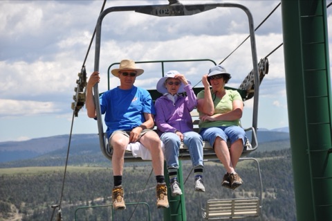 2013 1 man two woman at top of triple chair