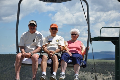 2013 2 men and 1 woman on chairlift near top of mountain