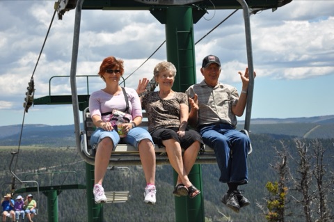 2013 2 women and man on triple chair