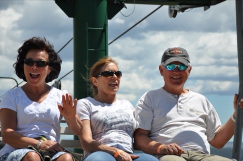 2013 3 people on chairlift at top of mountain2