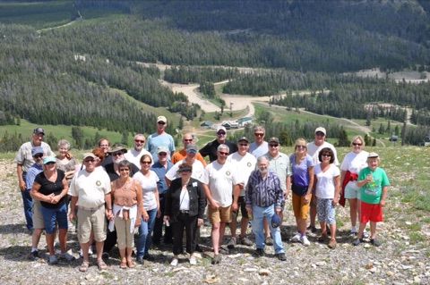 2013 Ski Patrol group with base lodge in view