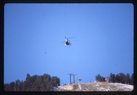 1978 Triple Chairlift Construction Helicopter in the air setting tower near top