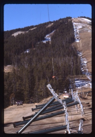 1978 Triple Chairlift Construction Helicopter picking lift towers up from parking lot