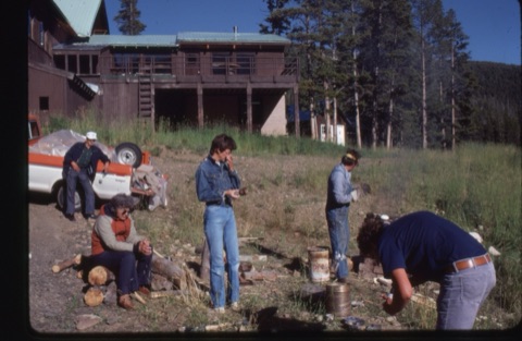 1981 Margie WIllett, Don Hansen firing pottery near lodge