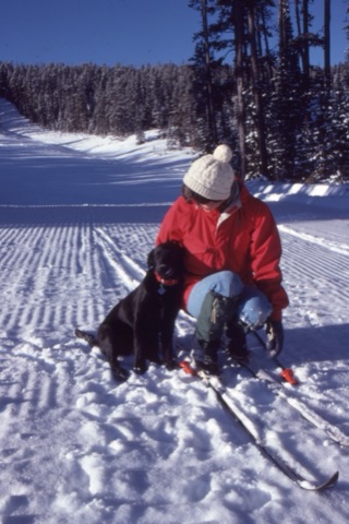 1982 Margie Willett and Ben the Dog skiing